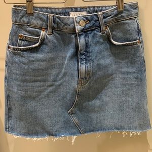 Jean mini skirt with raw edge hem